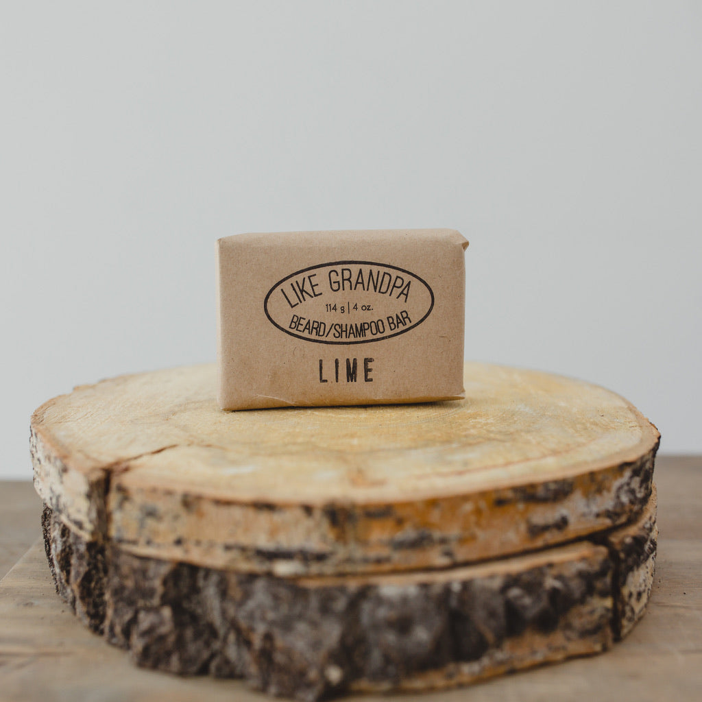 Lime Shampoo Bar wrapped in brown paper. 