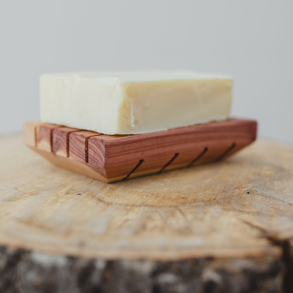 All-natural shampoo bar on natural Cedar soap saver.